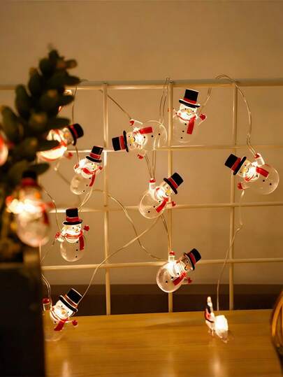 1 pièce Guirlande lumineuse de bonhomme de neige de Noël, alimentée par batterie, convient pour les décorations de Noël et d'hiver. Une lumière décorative de style entourant l'arbre de Noël, convient pour les salons, les chambres à coucher et les salles à manger intérieurs. Convient également pour être suspendu dans les vitrines de magasins, les cheminées, les décorations d'escalier, les porches extérieurs et les décorations de jardin, comme lumières d'ambiance pour les fêtes de Noël, et comme cadeaux de Noël raffinés.