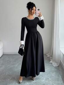 Sophisticated Women's Knitted Fabric Long Sleeve Black Dress, Featuring A Pearl-Detailed Round Neck, White Cuffs, And A Flared A-Line Silhouette For An Elegant Look