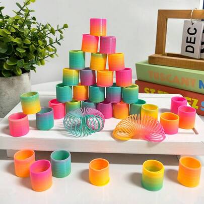 12/24/36/48/60 stycken/höst- och vinterregnbågsfestpresenter, mini-plastleksaker i slumpmässiga former och färger, mini-fjäderformade elastiska leksaker med dekompressionsspiral, lämpliga som födelsedagspresenter för män och kvinnor, karnevalsutmärkelser, presentpåsfyllning, presentpåsfyllning (mini)