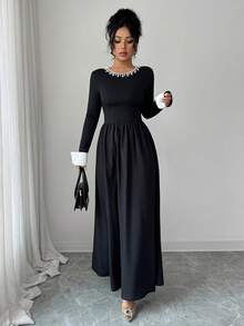 Sophisticated Women's Knitted Fabric Long Sleeve Black Dress, Featuring A Pearl-Detailed Round Neck, White Cuffs, And A Flared A-Line Silhouette For An Elegant Look