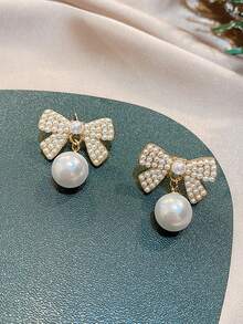 1 par de pendientes de lazo elegantes y geométricos para mujer, accesorios de joyería elegantes para ropa diaria. Pendientes de lazo dorados de Navidad, regalos navideños y de Año Nuevo. Pendientes de verano con diseño de lazo, accesorios de joyería para fiestas en la playa. - pendientes de lazo - Ver 7