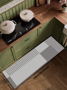 1 块硅胶厨房垫，几何拼布图案，由不同深浅的灰色方形和矩形块组成，设计时尚奢华，可缓冲和缓解厨房疲劳，表面织物材料带有吸水海绵中间