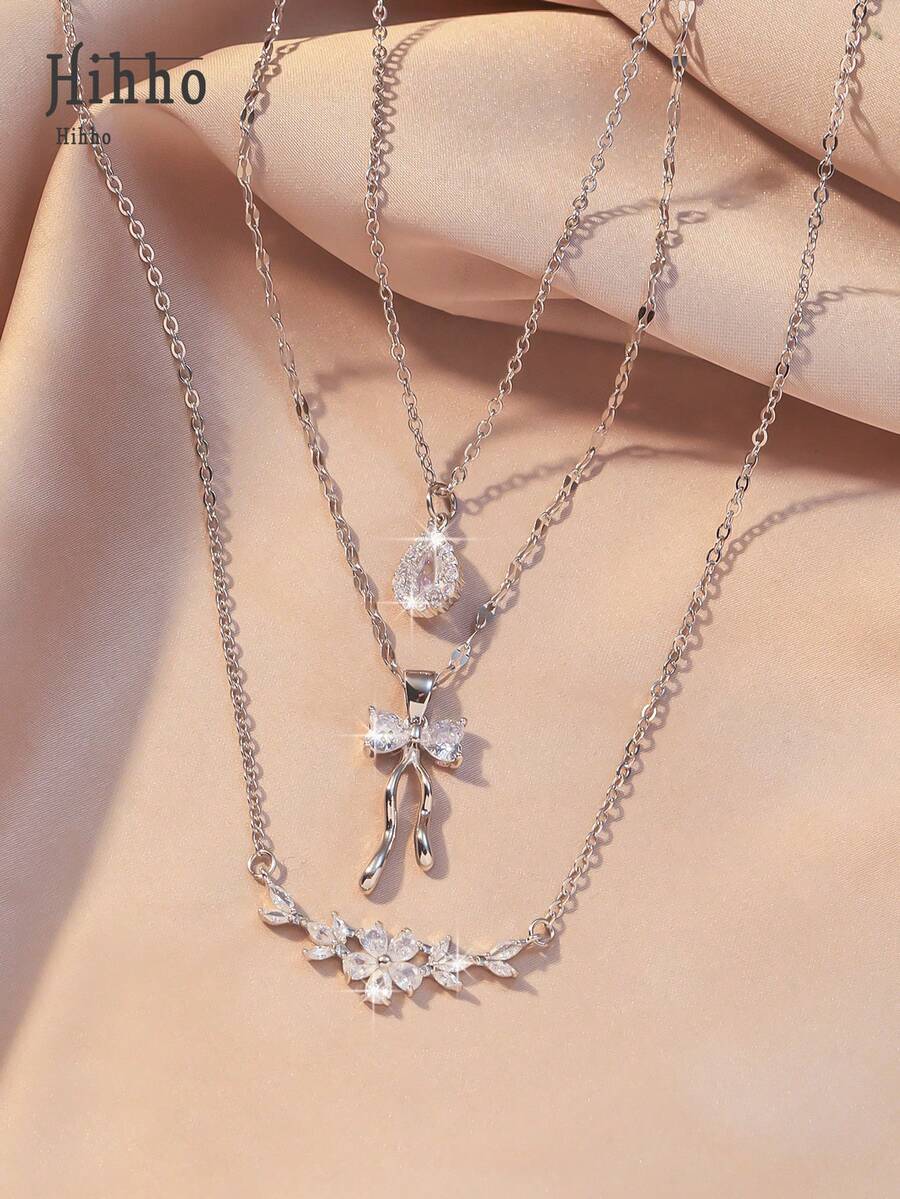 Hihho Set de 3 piezas de collar con diseño de lazo, flor y gota incrustada con circonita, regalo de joyería de lujo personalizada y elegante para mujeres - Plateado - Ver 1