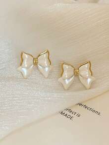 1 par de pendientes de lazo elegantes y geométricos para mujer, accesorios de joyería elegantes para ropa diaria. Pendientes de lazo dorados de Navidad, regalos navideños y de Año Nuevo. Pendientes de verano con diseño de lazo, accesorios de joyería para fiestas en la playa. - pendientes de lazo - Ver 17