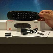 teclado inalámbrico compacto de 5.0 pulgadas con diseño ergonómico y retroiluminación LED ajustable, ideal para controlar dispositivos Smart TV, PC, laptops, y sistemas multimedia; incluye función Air Mouse para navegación precisa y cómoda sin necesidad de ratón adicional, conexión inalámbrica estable vía tecnología avanzada de bajo consumo, batería recargable de larga duración, compatible con múltiples plataformas y sistemas operativos; perfecto para gaming, trabajo remoto y uso cotidiano en el hogar u oficina, portátil y ligero para fácil transporte, con teclas suaves y silenciosas para mayor confort en sesiones prolongadas; accesorios y configuración rápida incluidos para una experiencia inmediata y fluida de uso en ambientes oscuros o poco iluminados. - Negro - Ver 1