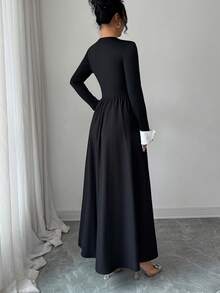 Sophisticated Women's Knitted Fabric Long Sleeve Black Dress, Featuring A Pearl-Detailed Round Neck, White Cuffs, And A Flared A-Line Silhouette For An Elegant Look