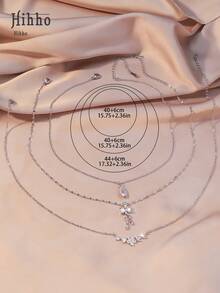 Hihho Set de 3 piezas de collar con diseño de lazo, flor y gota incrustada con circonita, regalo de joyería de lujo personalizada y elegante para mujeres - Plateado - Ver 4