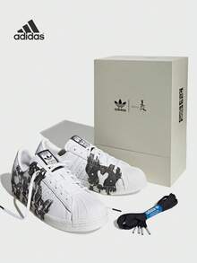Adidas Adidas (ADIDAS) Adidas Originals Superstar 80s Chinesisches Sternzeichen Hund, rutschfeste und verschleißfeste Sneaker mit niedrigem Schaft, Unisex Weiß und Schwarz SUPERSTAR 80S CHINESE ZODIAC DOG