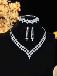Conjunto de joyería de 4 piezas con collar, aretes y pulsera con cristales de lujo y diseño geométrico, accesorios elegantes y versátiles adecuados para uso diario, bodas, fiestas y como regalo para mujeres