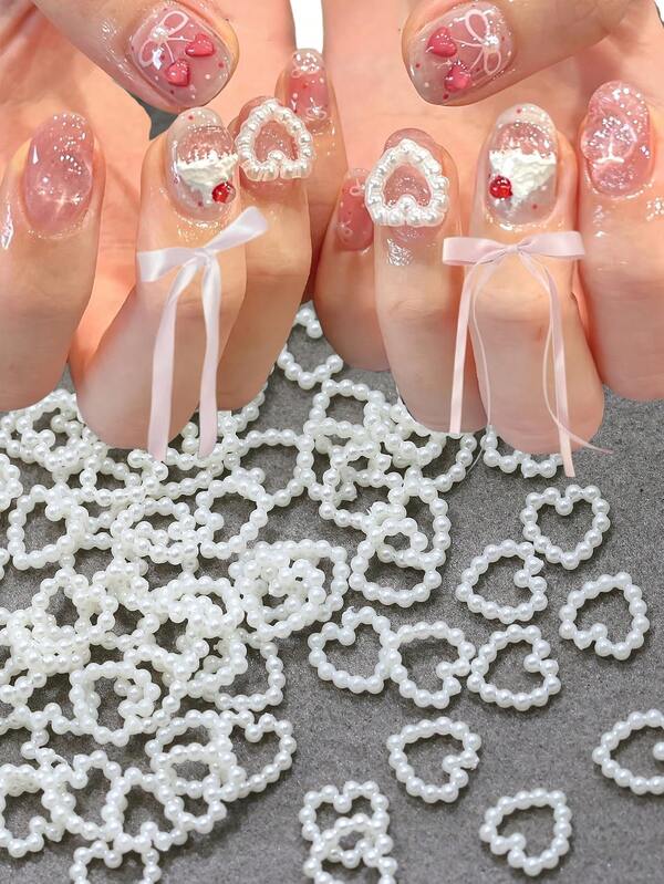 50 pezzi/Borsa Perle bianche a forma di cuore cavo Decorazione unghie 3D Strass a forma di cuore piatto Decorazione unghie