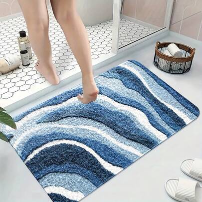 A Blue Wave-Patterned Rug Made Of Faux Cashmere, Suitable As A Non-Slip Mat For The Bathroom, Living Room, Or Bedroom. It Is Foldable And Washable, Making It A Soft And  Option For Bedside Use, As Well As A Decorative Piece For Home And Room