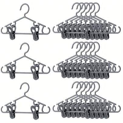 10个装儿童衣架，带夹子，塑料材质，适用于婴儿裤子、新生儿服装，可用于衣柜收纳、婴儿服装、外套、裙子、袜子等，轻便实用，品质优良，夹子牢固，配有挂钩，是托儿所必备用品，也是新生儿节日礼物。