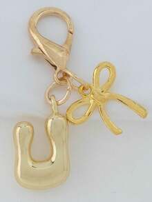 1个A-Z金色泡泡字母可爱吊坠，蝴蝶结装饰，钥匙扣，戒指托，背包挂饰，汽车挂饰，购物，海滩，露营，钱包配饰。适合作为送给女性、朋友和学生的礼物，时尚创意设计，生日礼物装饰，圣诞礼物。 - 金色蝴蝶結 - 查看 25