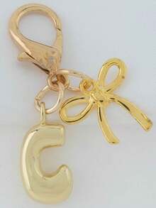 1个A-Z金色泡泡字母可爱吊坠，蝴蝶结装饰，钥匙扣，戒指托，背包挂饰，汽车挂饰，购物，海滩，露营，钱包配饰。适合作为送给女性、朋友和学生的礼物，时尚创意设计，生日礼物装饰，圣诞礼物。 - 金色蝴蝶結 - 查看 24