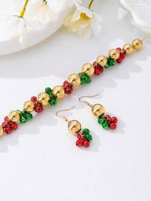 Set de 3 piezas de joyas de moda punk navideñas con un diseño minimalista de campanas, incluyendo collar, pulsera y aretes, un conjunto de joyas único para fiestas navideñas