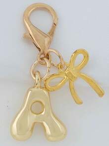 1个A-Z金色泡泡字母可爱吊坠，蝴蝶结装饰，钥匙扣，戒指托，背包挂饰，汽车挂饰，购物，海滩，露营，钱包配饰。适合作为送给女性、朋友和学生的礼物，时尚创意设计，生日礼物装饰，圣诞礼物。 - 金色蝴蝶結 - 查看 33