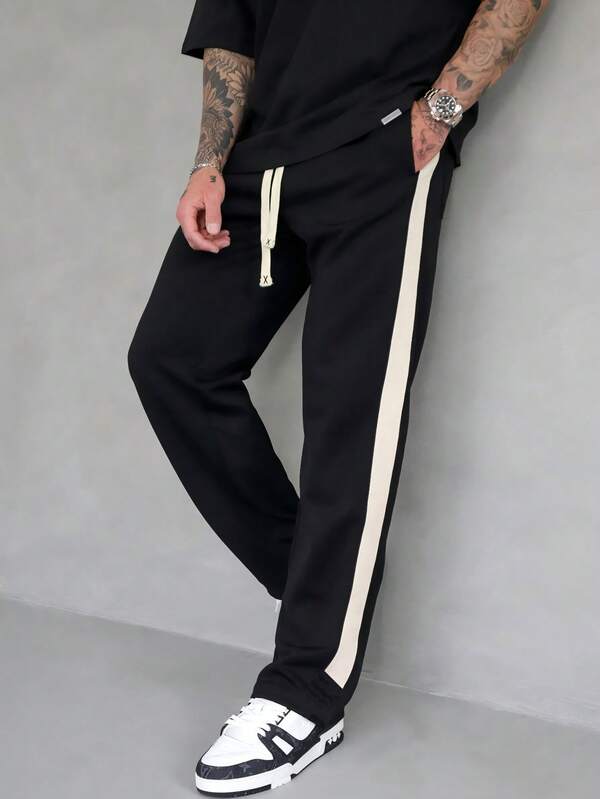 بنطلون رياضي كاجوال بخصر مرن وجيب بسحاب، بتصميم فضفاض وألوان متباينة، مناسب للارتداء اليومي وحفلات الموسيقى