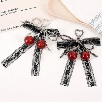 1 pezzo Ciondolo creativo e alla moda con fiocco in pizzo, ciondolo per borsa, ciondolo per telefono in ciliegia di alta qualità, accessori adatti come regalo per ragazze e donne