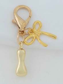 1个A-Z金色泡泡字母可爱吊坠，蝴蝶结装饰，钥匙扣，戒指托，背包挂饰，汽车挂饰，购物，海滩，露营，钱包配饰。适合作为送给女性、朋友和学生的礼物，时尚创意设计，生日礼物装饰，圣诞礼物。 - 金色蝴蝶結 - 查看 18