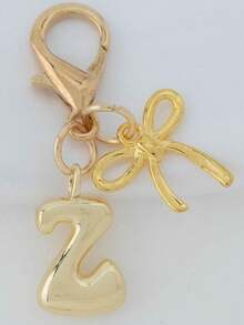 1个A-Z金色泡泡字母可爱吊坠，蝴蝶结装饰，钥匙扣，戒指托，背包挂饰，汽车挂饰，购物，海滩，露营，钱包配饰。适合作为送给女性、朋友和学生的礼物，时尚创意设计，生日礼物装饰，圣诞礼物。 - 金色蝴蝶結 - 查看 15