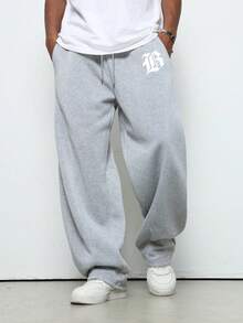 Pantalones de chándal holgados para hombres con cintura de cordón y bolsillos con estampado de letras informales casuales cómodos deportivos estilo urbano999 - Gris - Ver 1