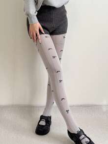 زوج من سراويل الجاكار للنساء ذات الخطوط الرأسية المتباينة اللون مع فيونكة، قطن بدون درز في أصابع القدم