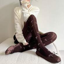 زوج من سراويل الجاكار للنساء ذات الخطوط الرأسية المتباينة اللون مع فيونكة، قطن بدون درز في أصابع القدم