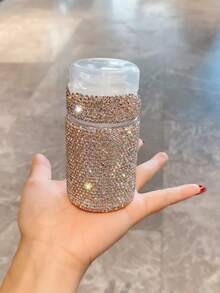 1 pieza Botella dispensadora de 100ml recargable de lujo con cristales de rinoceronte para desmaquillante y tónico, envase cosmético portátil amigable para viajes