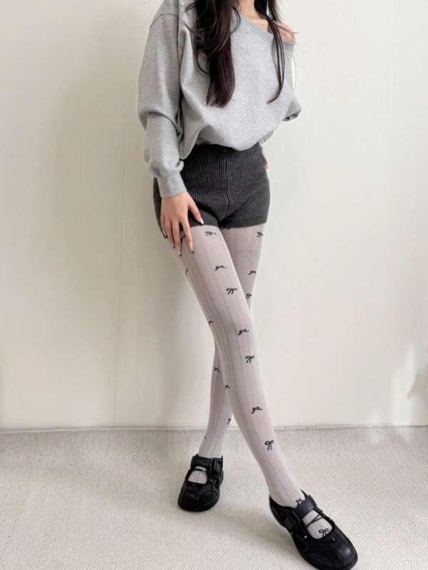 زوج من سراويل الجاكار للنساء ذات الخطوط الرأسية المتباينة اللون مع فيونكة، قطن بدون درز في أصابع القدم