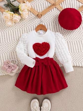 Conjunto de blusa de manga abullonada con estampado de corazones rosas y falda con moño para niñas, otoño/invierno