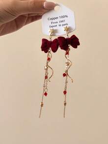 1 par de pendientes de estrella fugaz giratorios, pendientes de lazo adorables con diseño de nicho dulce, adecuados para otoño/invierno y Año Nuevo