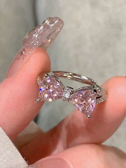 1 Stück luxuriöser Schleifenring mit rosa Kristall, einzigartiges Design Herz-förmiger verstellbarer Fingerring für Frauen