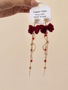 1 par de pendientes de estrella fugaz giratorios, pendientes de lazo adorables con diseño de nicho dulce, adecuados para otoño/invierno y Año Nuevo