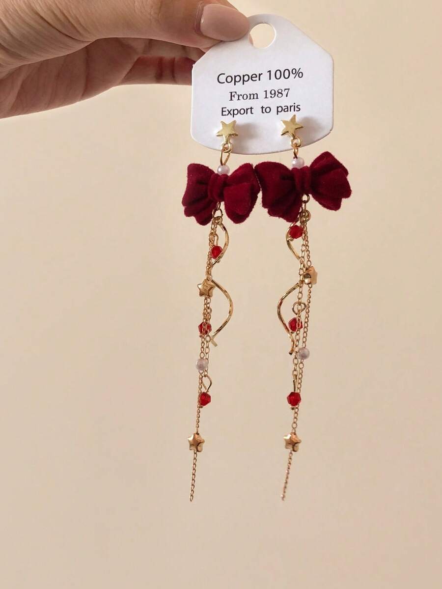 1 par de pendientes de estrella fugaz giratorios, pendientes de lazo adorables con diseño de nicho dulce, adecuados para otoño/invierno y Año Nuevo