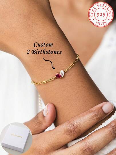 A 925 Sterling Silver Birthstone Bracelet, Featuring Customisable Birthstone Jewellery With A Paperclip Chain, Perfect For Birthdays, Anniversaries And Festive Celebrations-An Ideal Gift For Mother's Day. A Double-Gemstone Heart-Shaped Birthstone Ring. A Simple Yet Personalised Gift, Ideal For Cherished Friends, Confidants And Mothers.