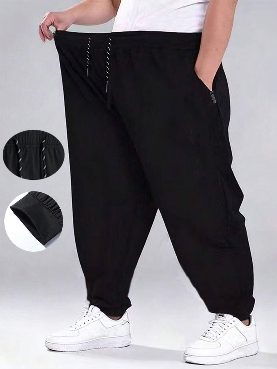 男士加大码轻薄宽松休闲运动裤，带拉链口袋和抽绳腰带，修身慢跑裤，适合日常穿着和运动。