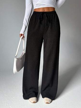 2025 New Women'S Black Textured Comfortable Pants. With Drawstring Design At The Waist, They Feature A Casual Yet Fashionable Style, Modify The Leg Shape To Make Legs Look Longer, And Are Versatile Trousers Suitable For Fitness And Leisure Tights