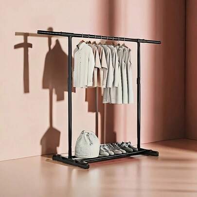 1pc Minimalist Luxury Black Mobile Floor Clothes Rack. Minimalist Luxury Black Floor Clothes Rack With Wheels, Flexible Mobility. Single Rod Can Hang Dresses, Daily Clothes, And The Bottom Can Store Shoes, Suitable For Bedroom Clothing Storage, Fitting Room Display And Matching, Adding Convenience And Sophistication To Your Wardrobe Organization.