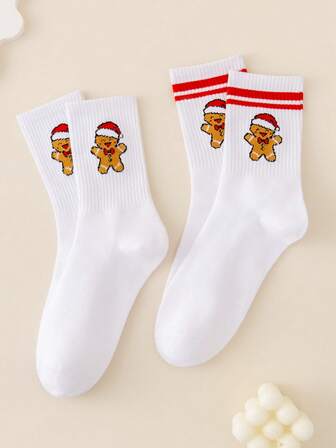 2 par röd- och vitrandiga julstrumpor till mitten av vaden, luktresistenta, fukttransporterande, mjuka och bekväma, avslappnade söta strumpor med jultomtehatt och pepparkaksgubbedekor, lämpliga för julklappar, hem, sömn, utomhussport, högtidsfester och vardagsbruk på hösten/vintern