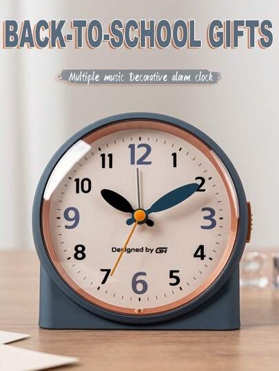 This 4.5-Inch Bedroom Music Alarm Clock Features Silent Operation And A Stylish Design That Easily Blends Into Your Bedroom, Office, Or Dorm Room, Making It The Perfect Addition To Any Space. It Features A Night Light And Snooze Function And Is Powered By Two AA Batteries (Batteries Not Included).