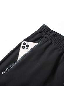 男士加大码轻薄宽松休闲运动裤，带拉链口袋和抽绳腰带，修身慢跑裤，适合日常穿着和运动。