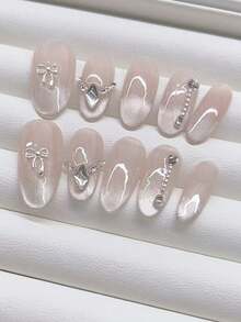 10 miếng dán móng tay hình oval thủ công, thiết kế nơ cổ kiểu mắt mèo ombre màu hồng nude. Tối giản và thời trang, có thể tháo rời và tái sử dụng, phù hợp với mọi phong cách của các cô gái. - Nhiều màu - Xem 2