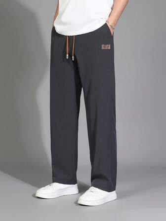 Pantalones largos para hombres de unicolor, con cintura ajustable con cordón y bolsillos en diagonal, de peso ligero