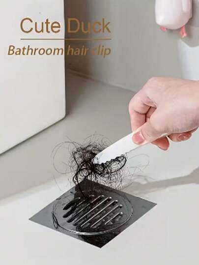 卡通鸭子造型毛发收集器，可重复使用，塑料材质，适用于厨房和浴室，无需用电，可过滤毛发和杂物，配有夹子和粘性部件，是清洁浴室水槽毛发的理想工具，也适用于露台、卫生间等场所。此外，它还是一款厨房配件、清洁用品、家居用品、家居装饰、浴室装饰及配件等家居用品。