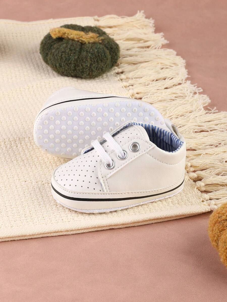 Ein Paar Babyschuhe mit Klettverschluss, rutschfeste Gummisohle und vielseitige einfarbige Sportschuhe, geeignet für Babys im Alter von 0-9 Monaten im Frühling und Herbst