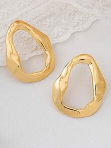 1 par de pendientes asimétricos de oro metálico