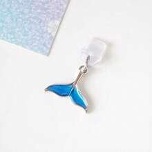 1 pieza Tapón antipolvo para smartphone con diseño de cola de sirena azul, accesorio creativo y elegante con colgante de metal de aleación con diseño de cola de sirena o ballena de la serie oceánica, tapón de silicona transparente para teléfono, auriculares, tableta, Kindle, decoración para puerto de carga del teléfono