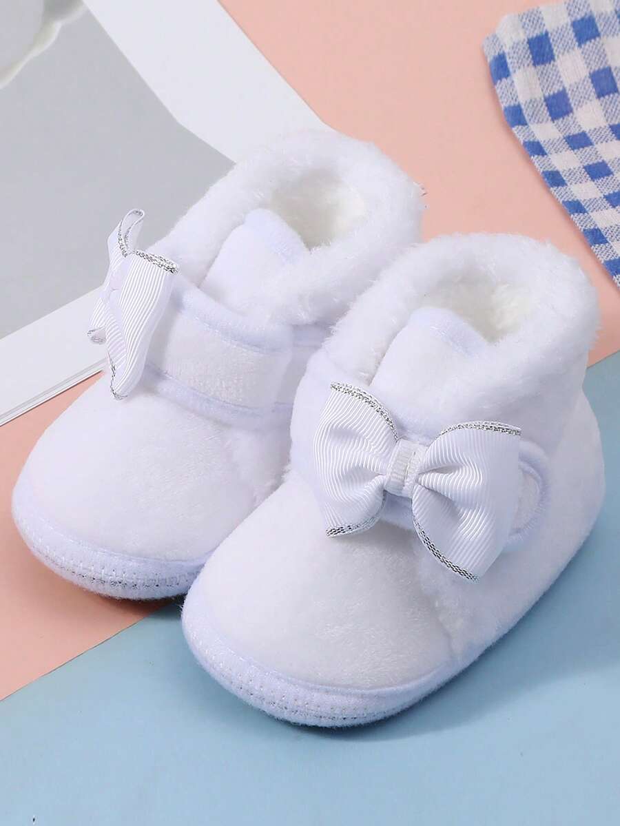 1 para bucików dziecięcych, ocieplane buty, odpowiednie do noszenia w pomieszczeniach i na zewnątrz, antypoślizgowe, ułatwiające naukę chodzenia, uroczy wzór kokardki, miękkie, płaskie buciki dla niemowląt, opcjonalnie wielokolorowe.