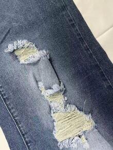 Jeans ajustados de mujer con efecto desgastado y lavado azul, elásticos y versátiles, aptos para el uso diario en todas las estaciones