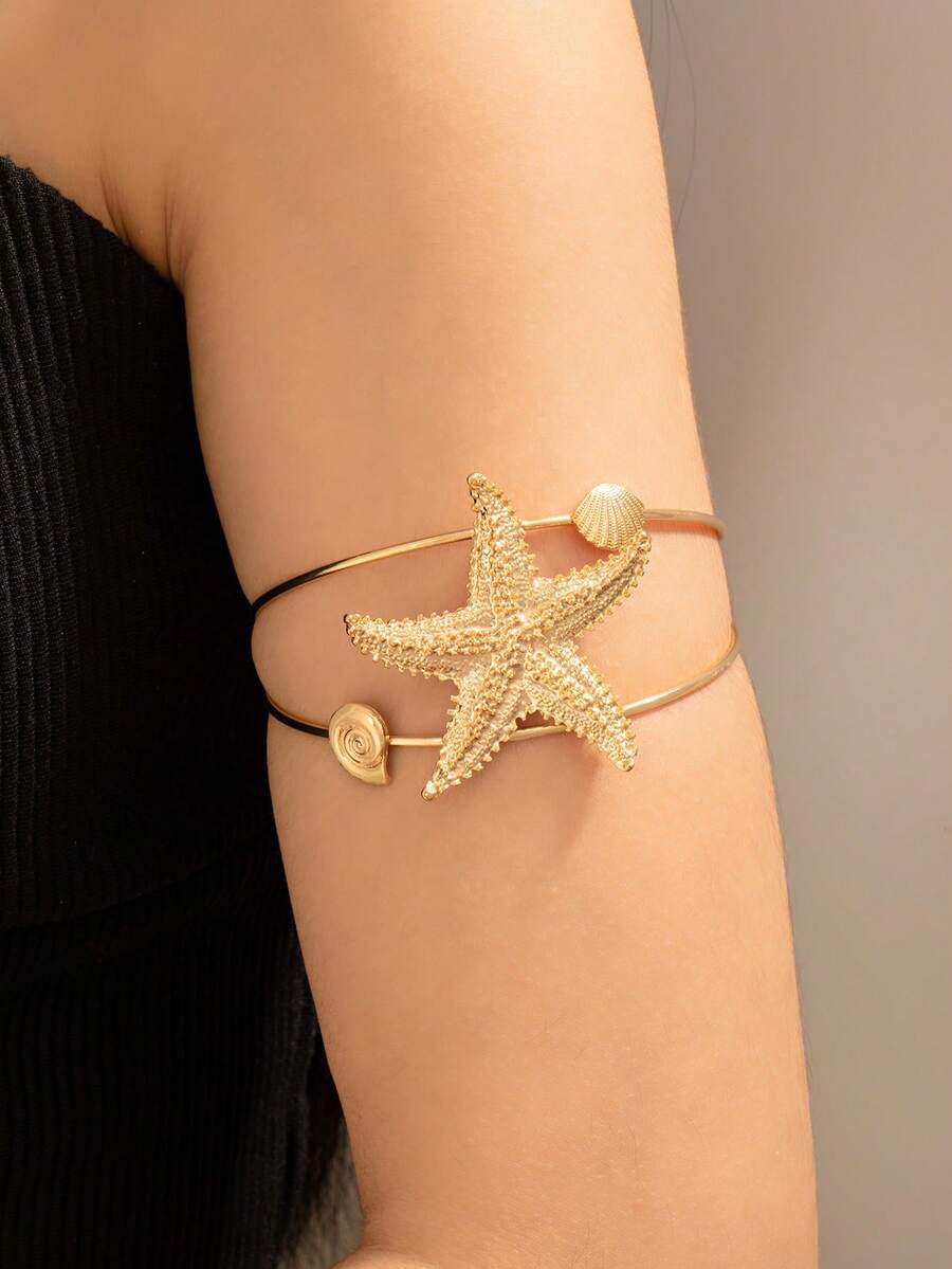 O coajă elegantă și la modă, cu strat dublu, în formă de stea de mare, cu deschidere reglabilă pentru brățară de damă